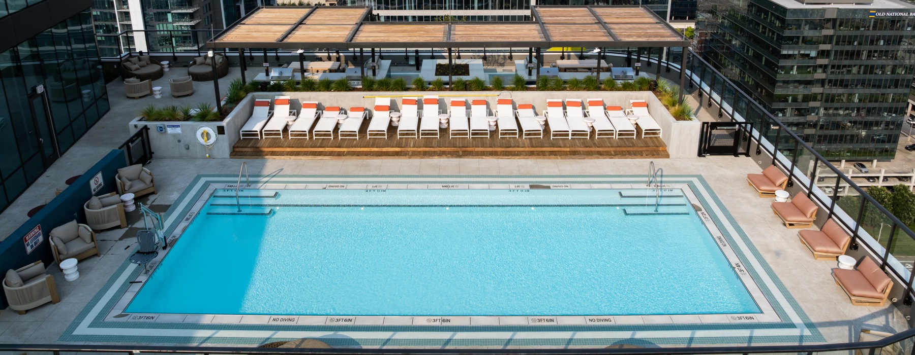 A row of poolside chaises at Albion Music Row apartments for rent in Nashville, TN.