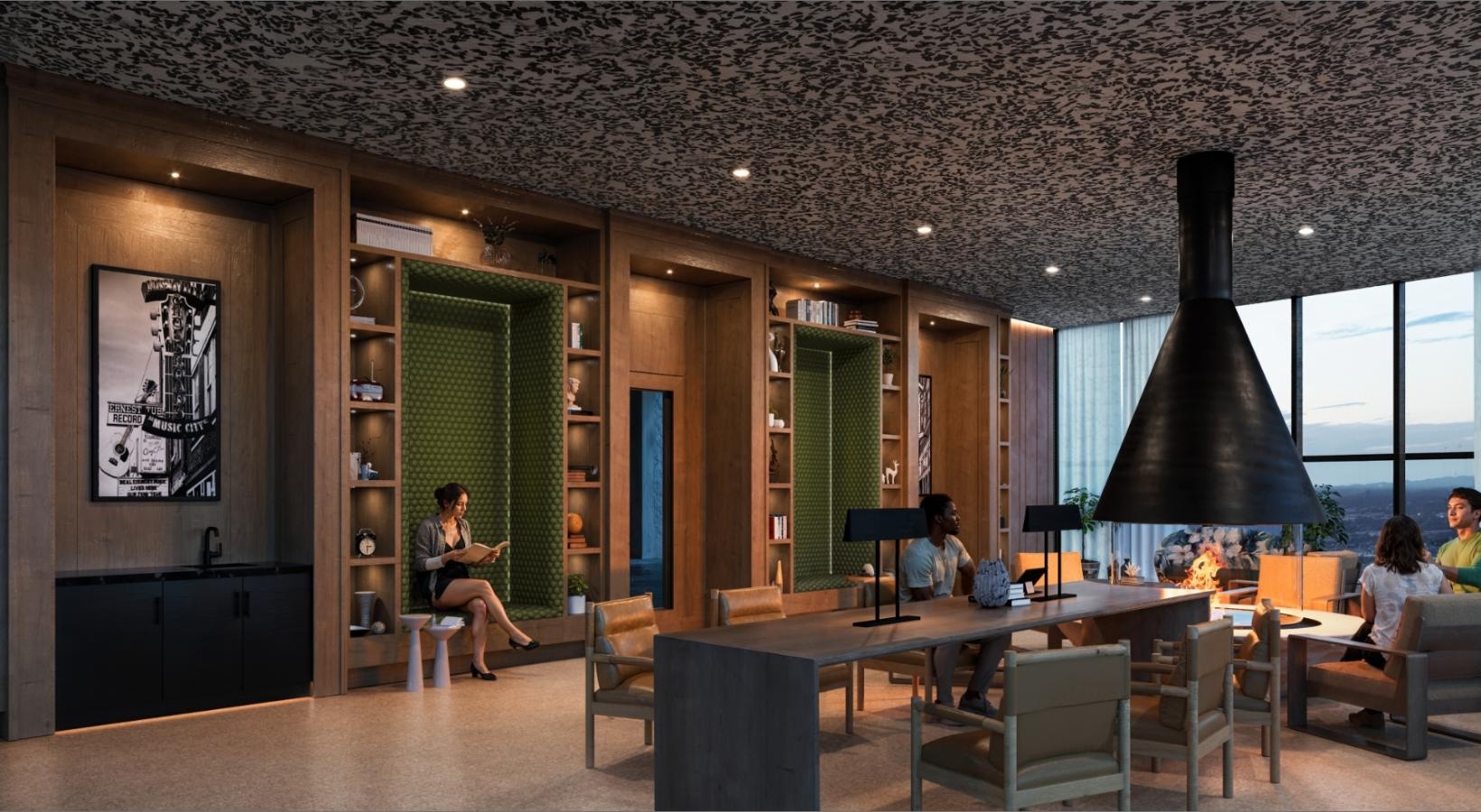 a group of people sitting at a table in a room with windows